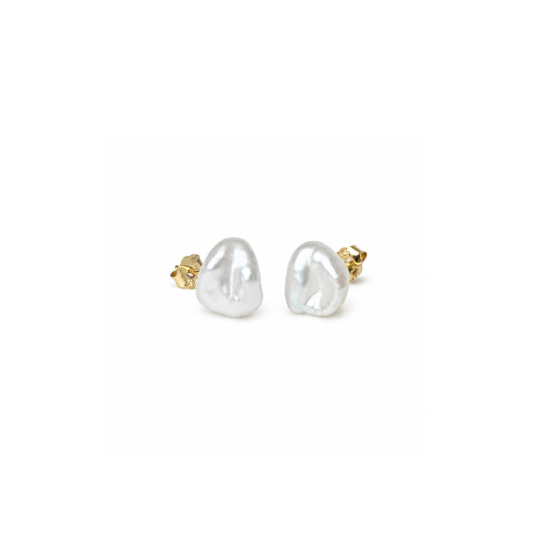 A pair of baroque pearl stud earrings with gold post backs, shown on a plain white background.