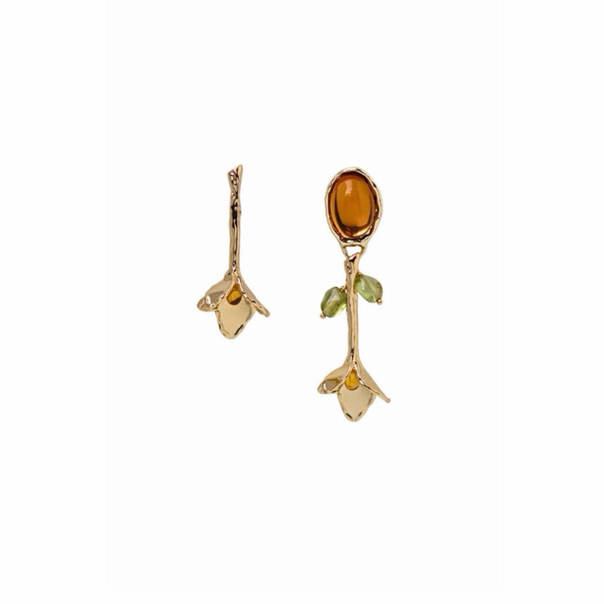 A pair of gold-toned earrings shaped like tulip, featuring a prominent oval amber-brown center stone on one earring, small green leaf accents, and godlen petal details on a plain white background.