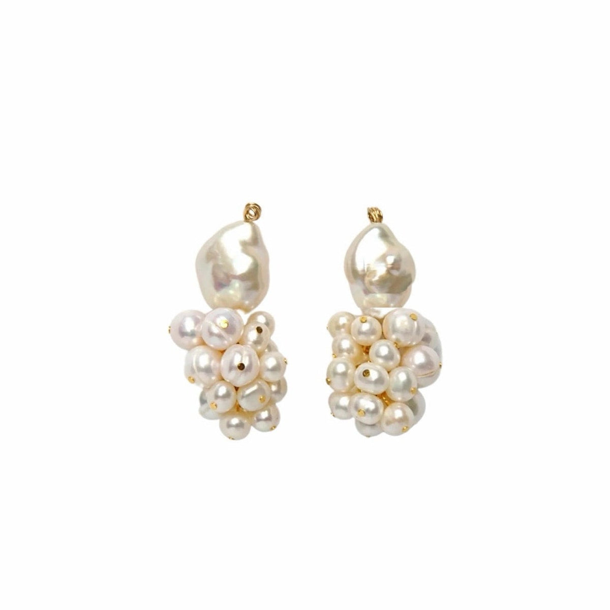 A pair of white pearl drop earrings consisting of a larger pearl on the top with a small pearl cluster below, shown on a solid white background.