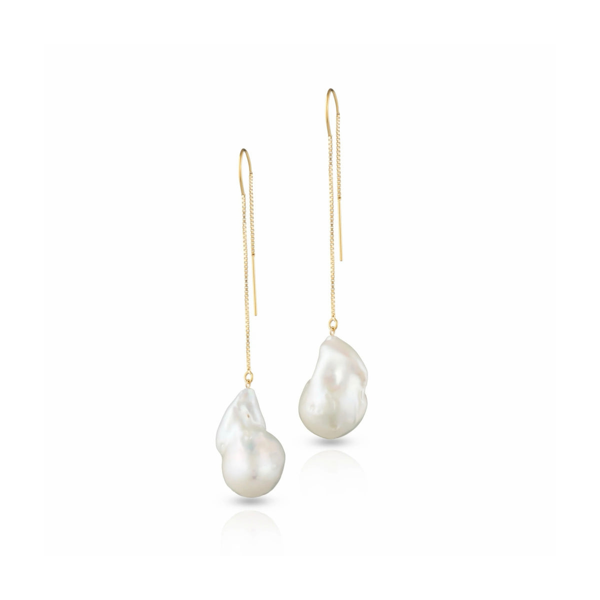 A pair of drop earrings in golden chain and hook with a single white baroque pearl hanging. Shown in a white background