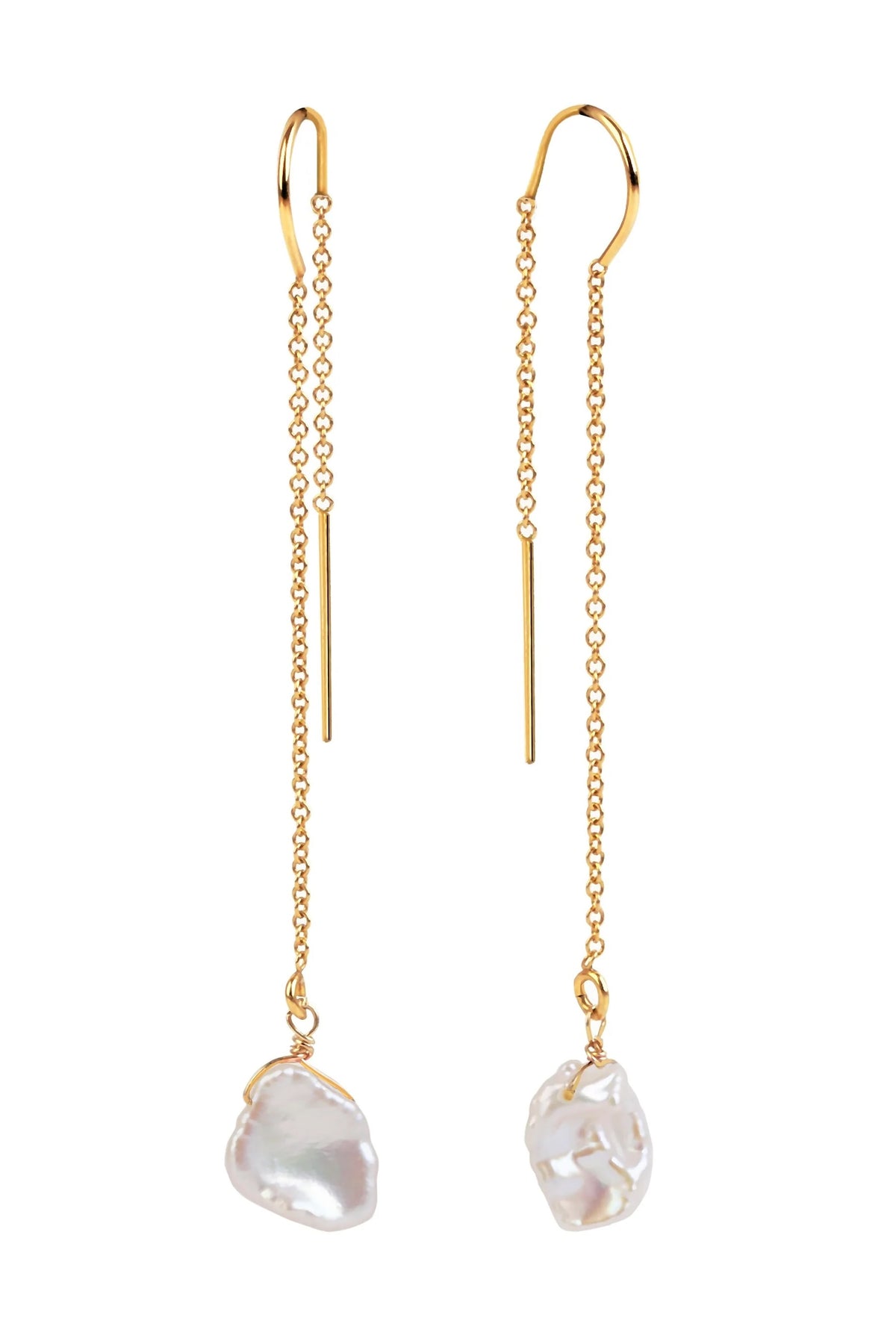 A pair of gold dangle earrings with long chains, slim bar charms, and irregular white keshi pearl drops on a plain white background.