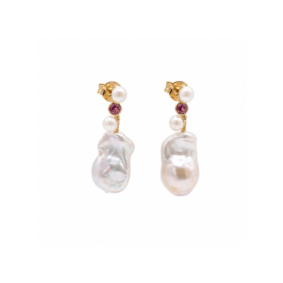 A pair of gold drop earrings featuring a large, irregular white baroque pearl, two small white pearls, and a tiny round purple gemstone, set against a plain white background.