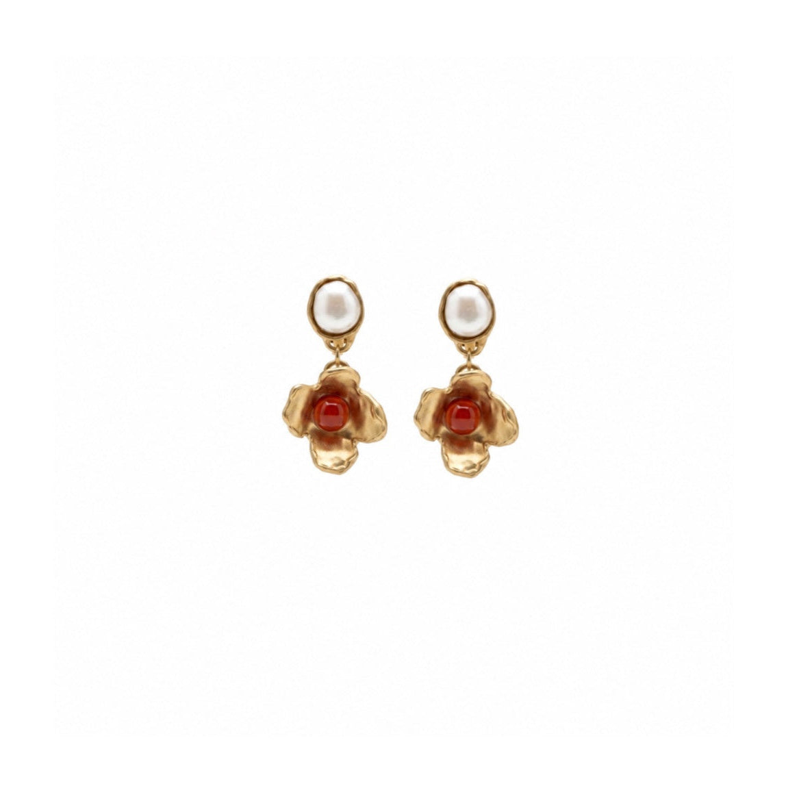 A pair of gold dangle earrings featuring a small white pearl oval at the top and a textured gold flower-shaped drop with a red gemstone in the centre, shown on a plain white background.
