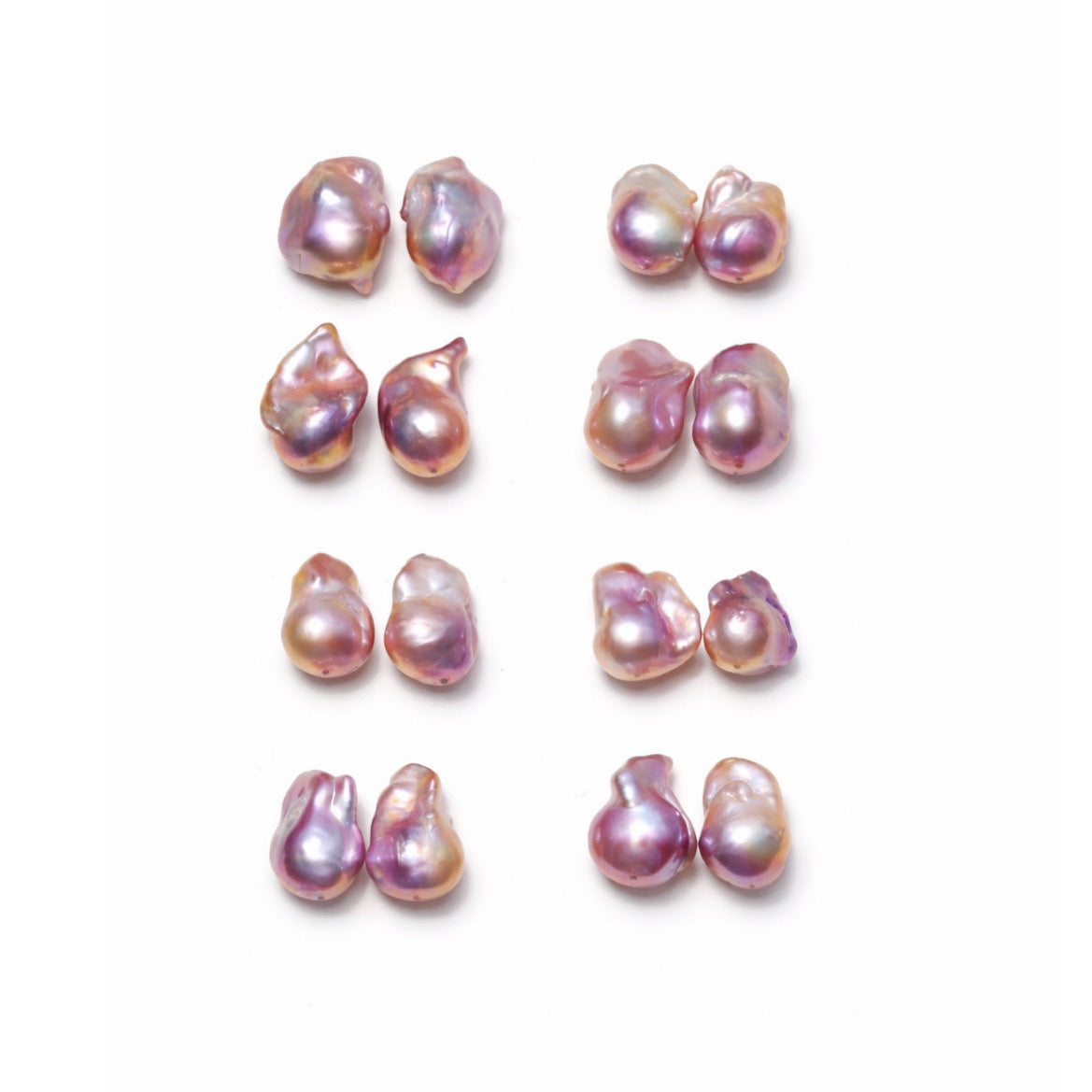 Eight pairs of irregular baroque freshwater pearls arranged in a grid on a plain white background. The pearls are of mixture of purple and pink tones.
