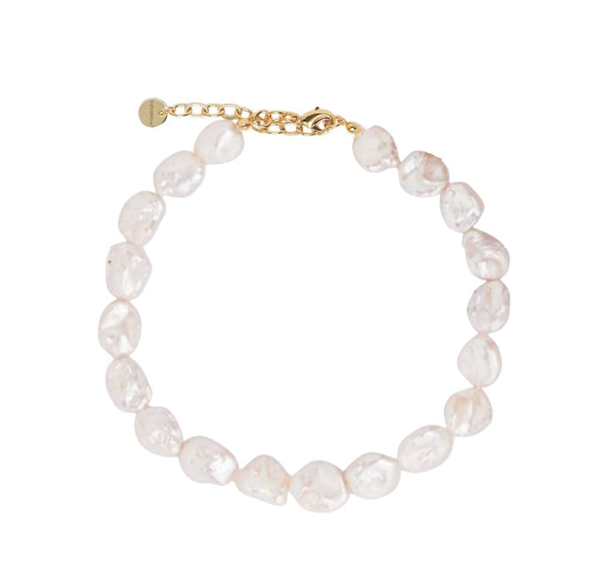 A delicate flat baroque pearl bracelet with a gold chain extender and lobster clasp, displayed on a clean white background.