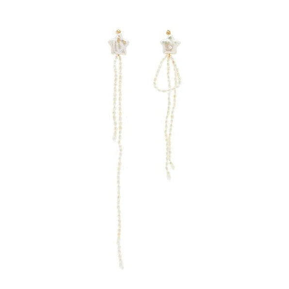 A pair of long dangling earrings with small gold-toned studs attached on start-shaped pearls with cascading strands of tiny pearl beads on a plain white background.