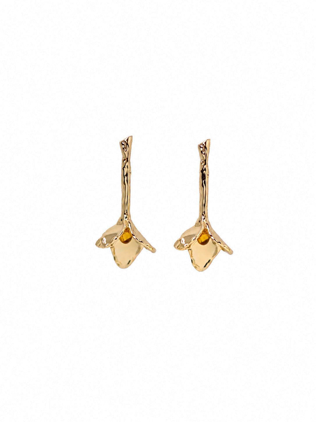 A pair tulip-shapred gold earrings in a plain white background.